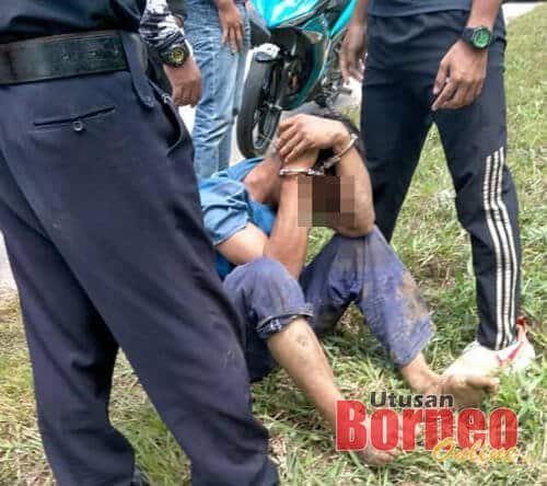 Suspek telah ditahan oleh orang awam sebelum diserahkan oleh polis. kredit gambar: UtusanBorneo