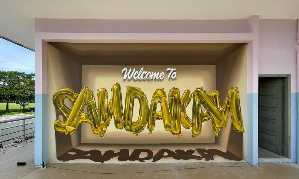 Kenali Jagung, Artis Mural Sarawak Yang Terkenal Dengan 'Trademark' Belon Huruf 3D